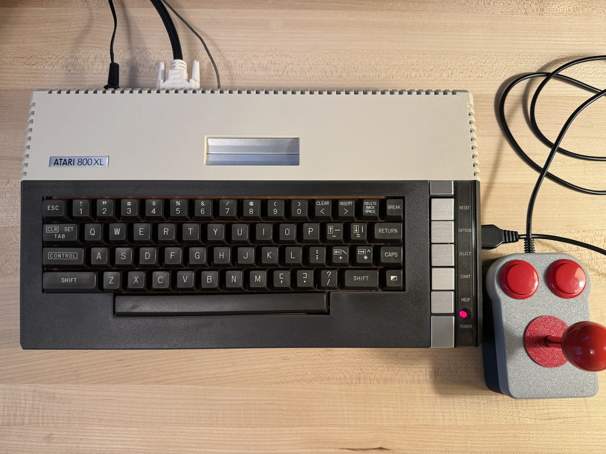 An original Atari 800XL computer with a DVI video cable extending from it