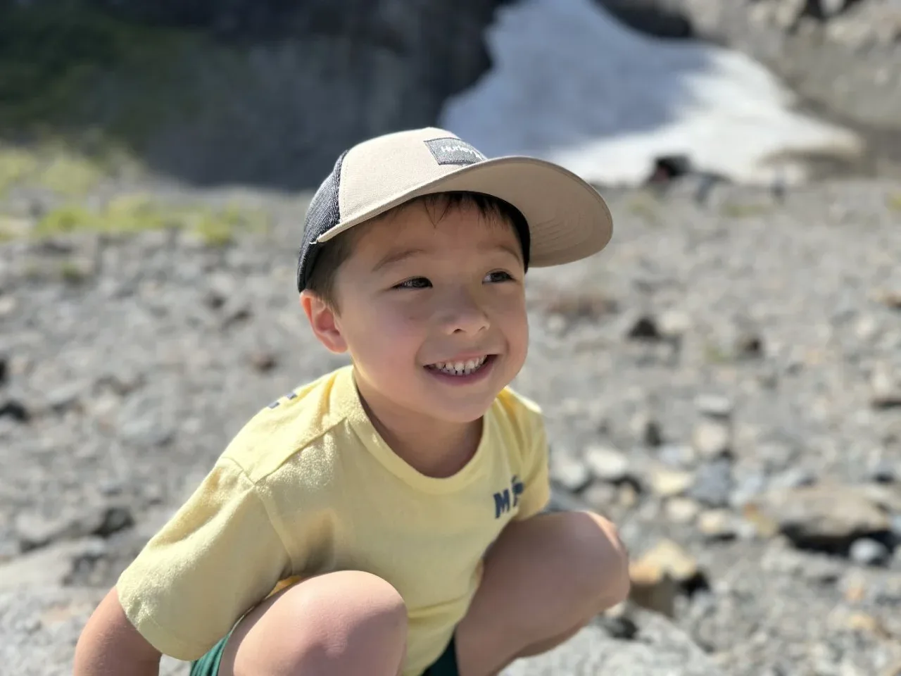 Tristan posing for a picture with the ice caves in the background.