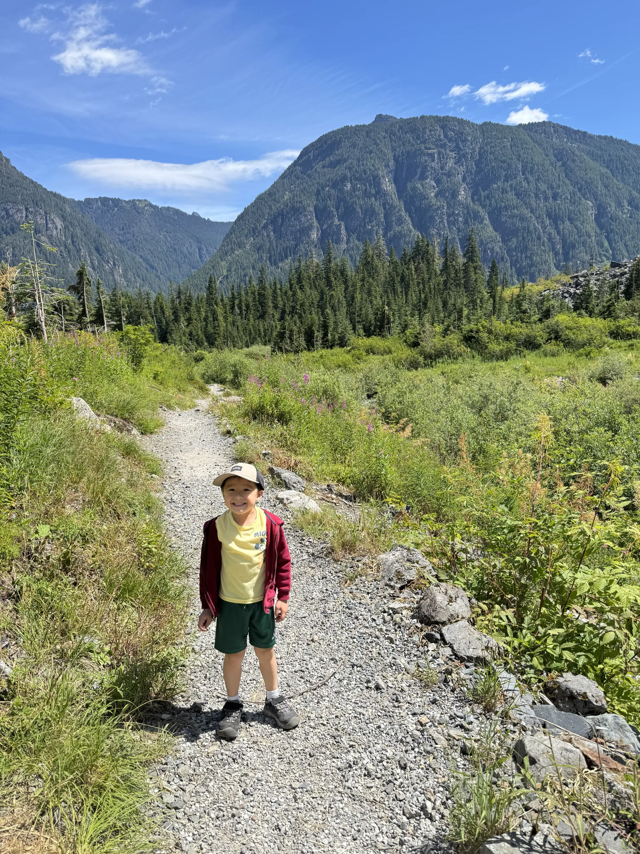 A trail with mountains in the distance.
