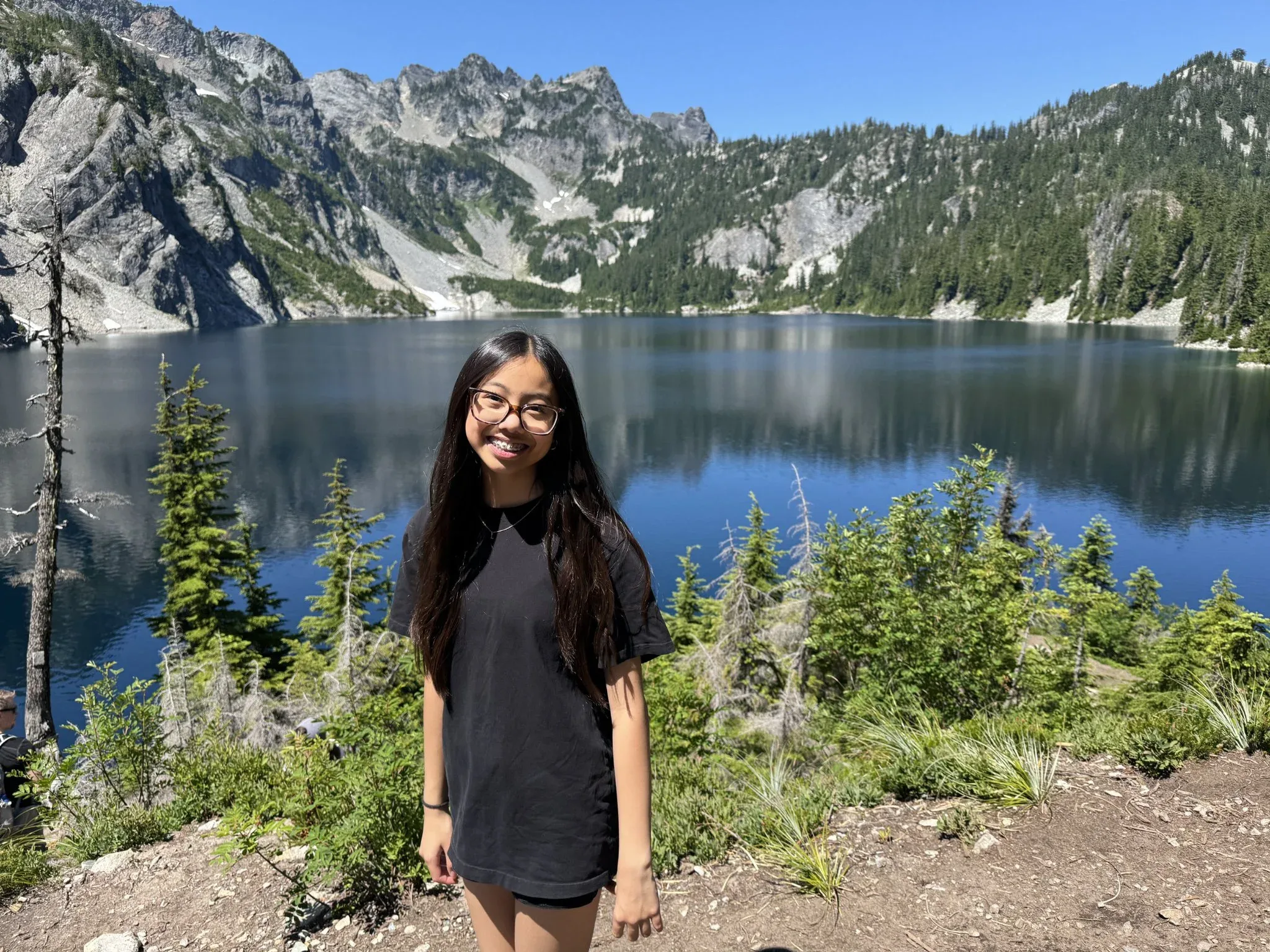 Leah with the slightly out of focus Snow Lake in the background.